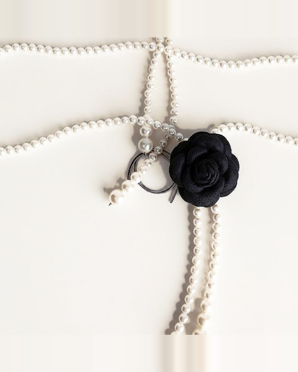 the bloom: black multi-strand faux pearl cord, laid out