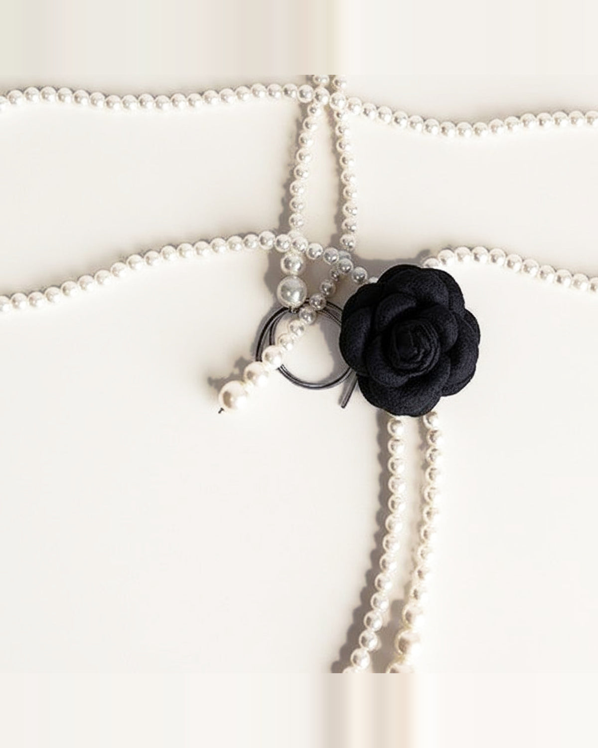 the bloom: black multi-strand faux pearl cord, laid out