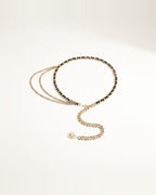the drop — gold and black woven waist chain