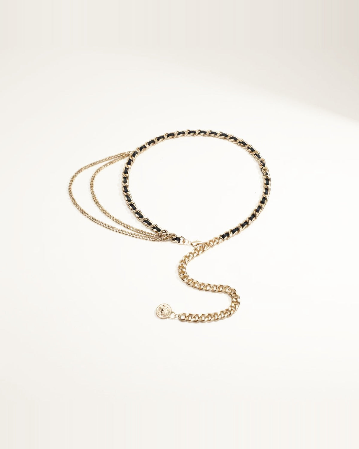 the drop: gold and black woven waist chain