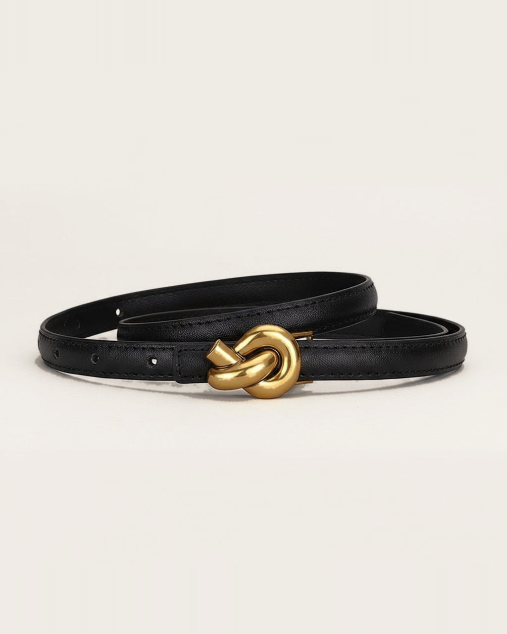 the line — black belt, coiled