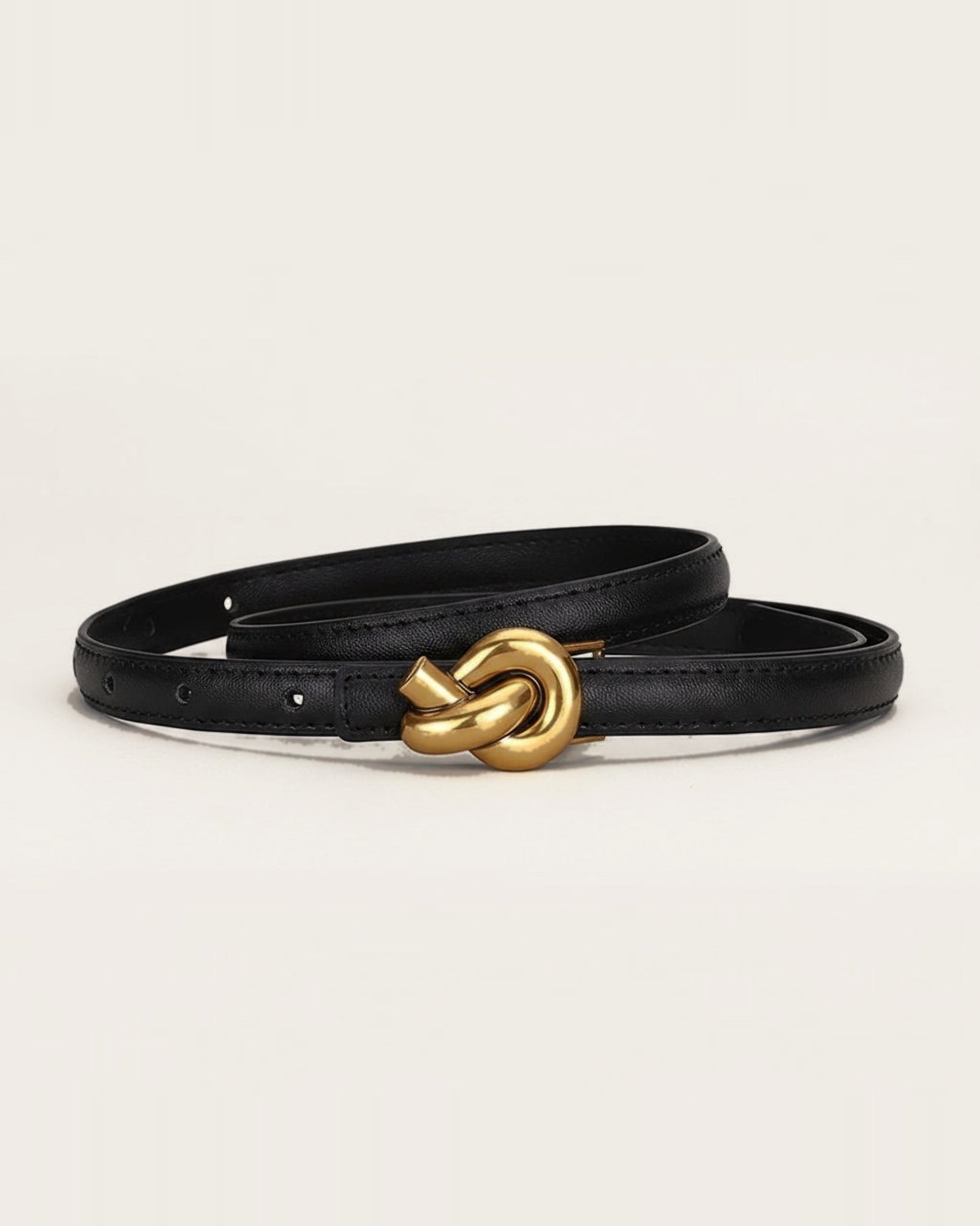 the line — black belt, coiled