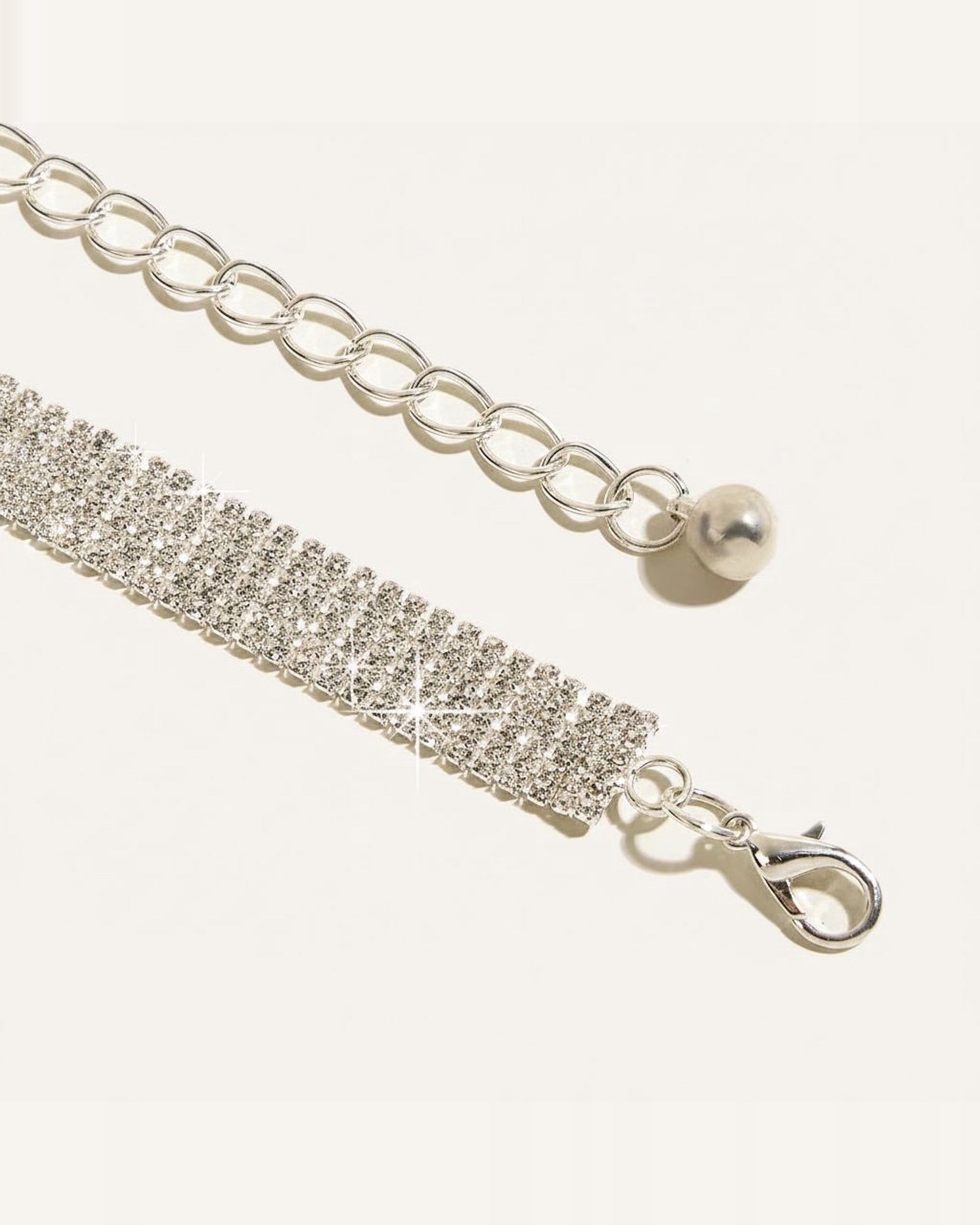 the pave: close view of the rows of pave stones, the extension chain and the lobster clasp