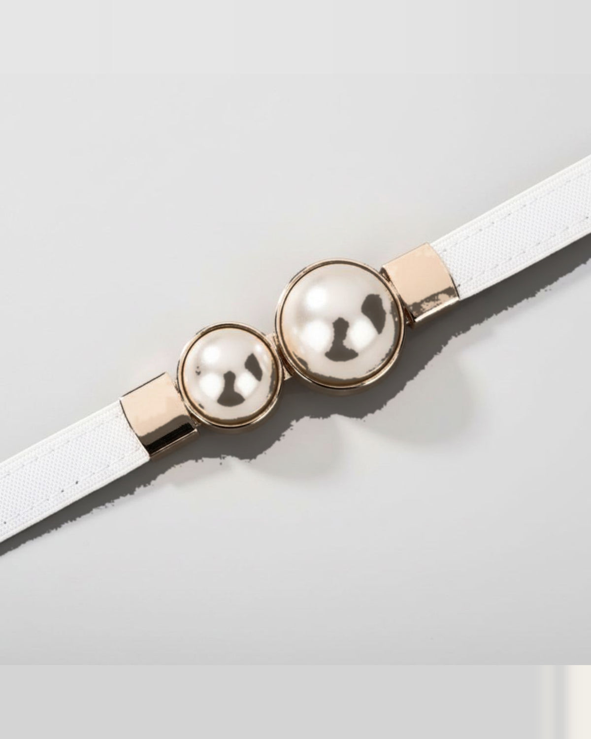 the pearl: ivory belt, coiled