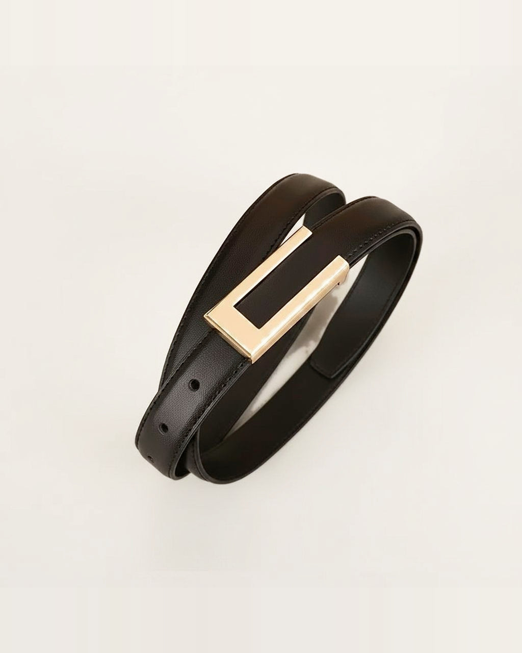 the rule — rectangular gold buckle and slim strap