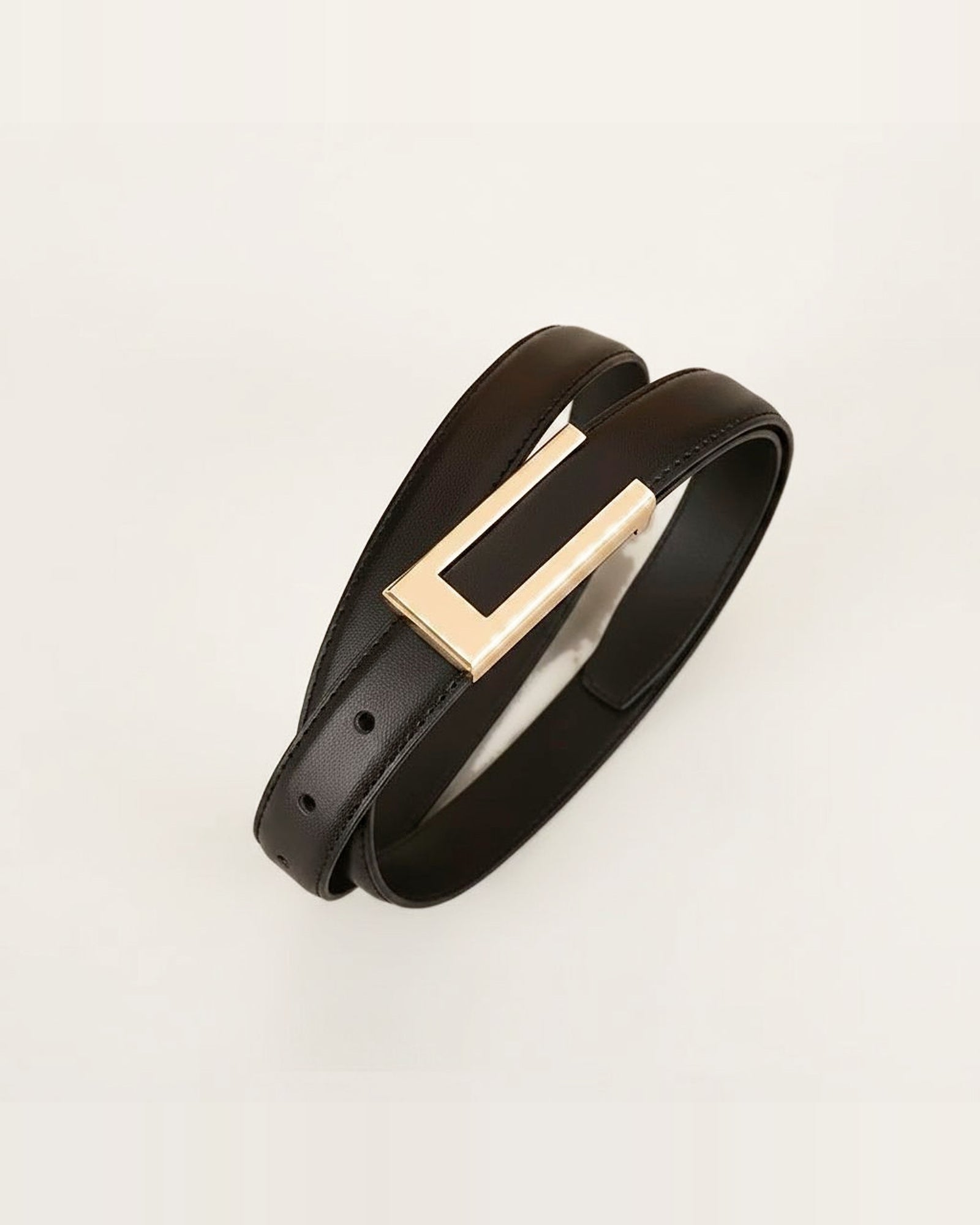 the rule — rectangular gold buckle and slim strap