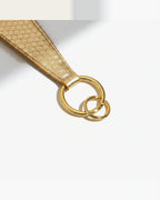 the scale: close view of the cast hardware, two joined rings and a bar