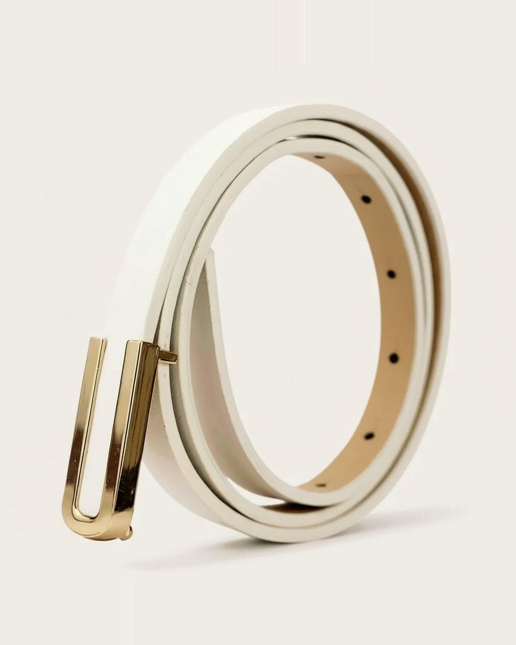 the thread — ivory belt, coiled