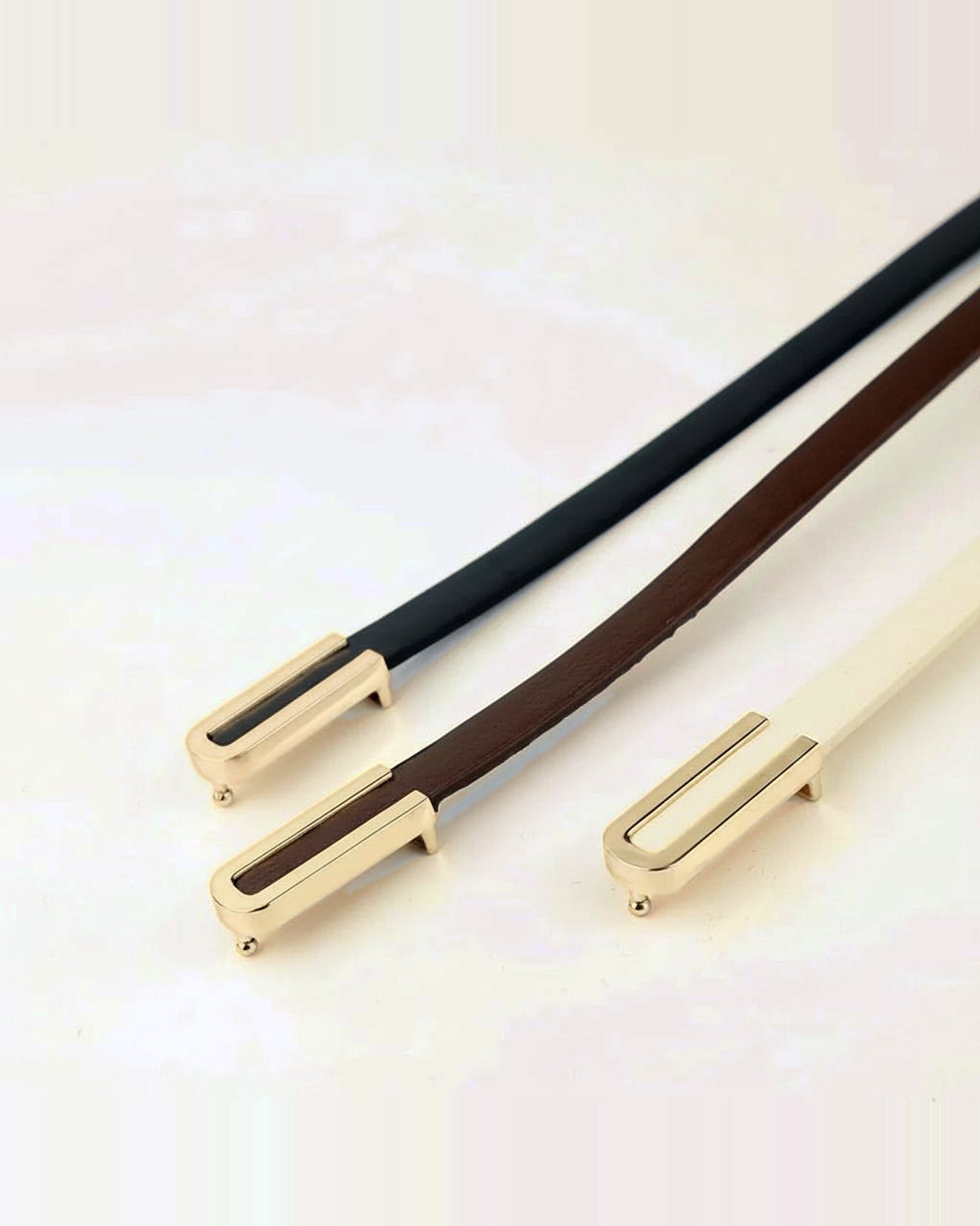 the thread — cast knot buckle, brown and black
